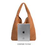 An ipad size comparison image for a large woven shoulder bag with a zip pouch inside.