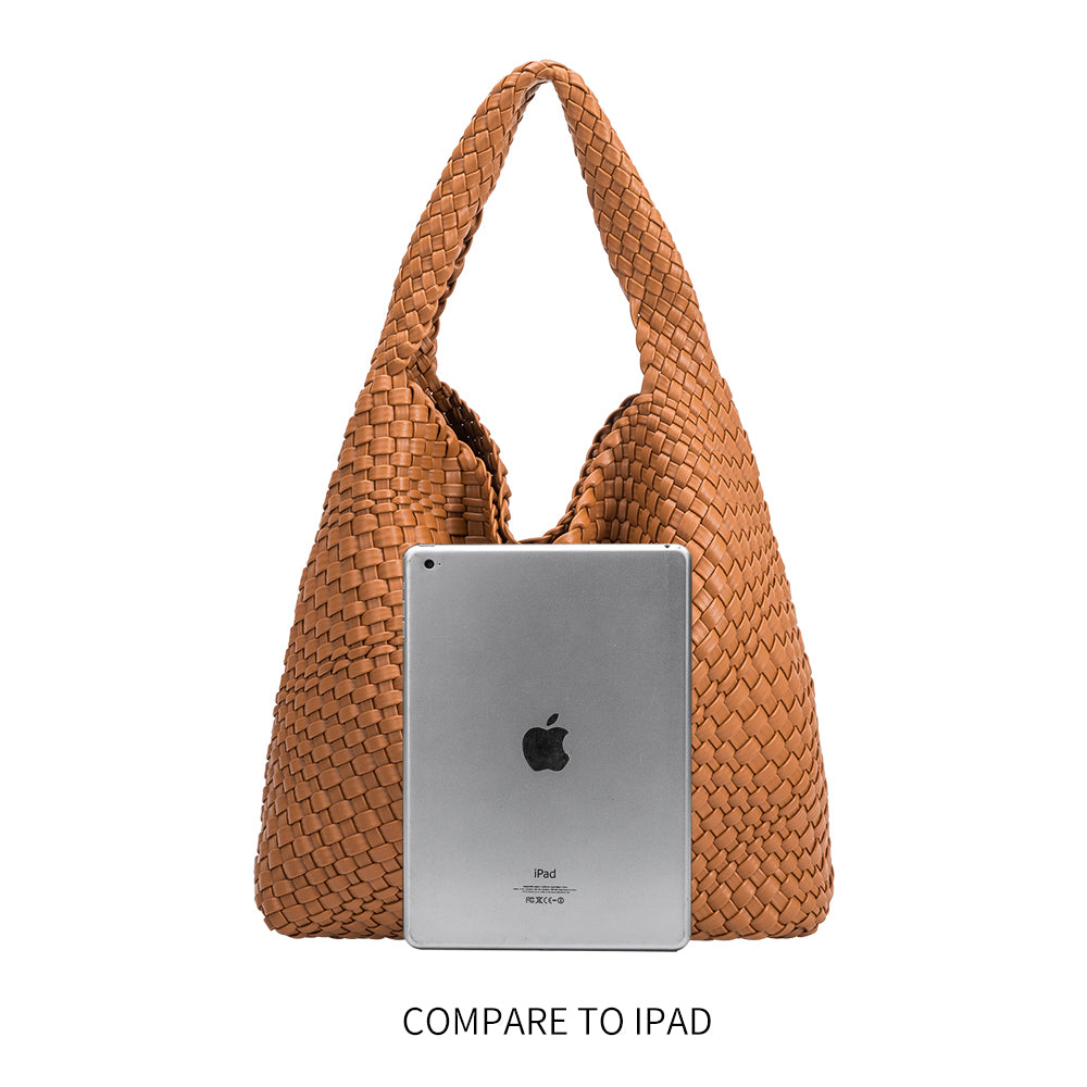 A lpad size comparison for a large woven vegan leather shoulder bag with a zip pouch inside