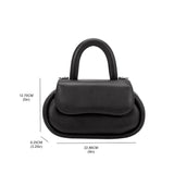 A measurement reference photo for a black oval shaped crossbody handbag. 
