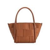 A small saddle woven wide strap vegan leather tote bag with double handle. 