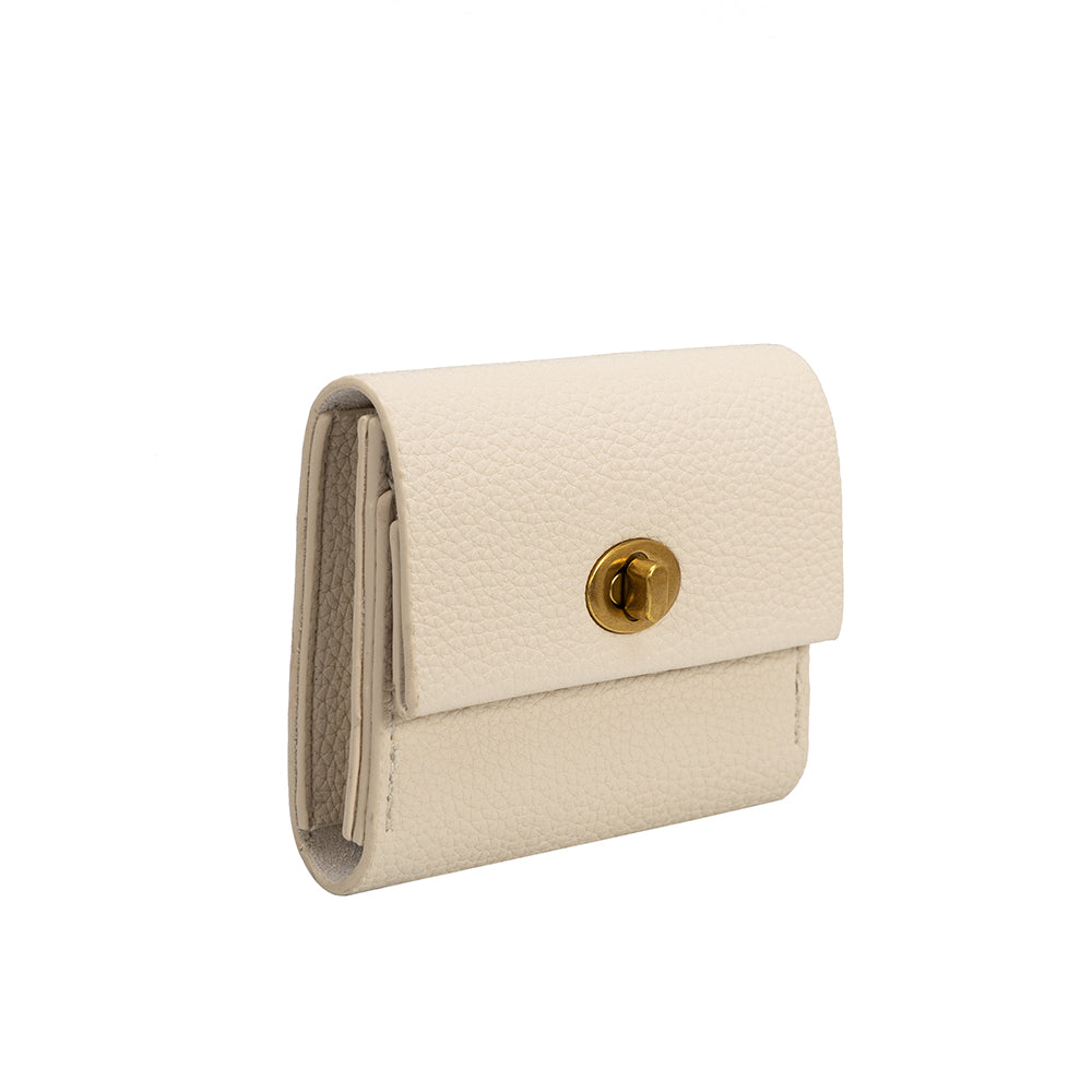 A small ivory pebble vegan leather card case wallet with a gold clasp. 