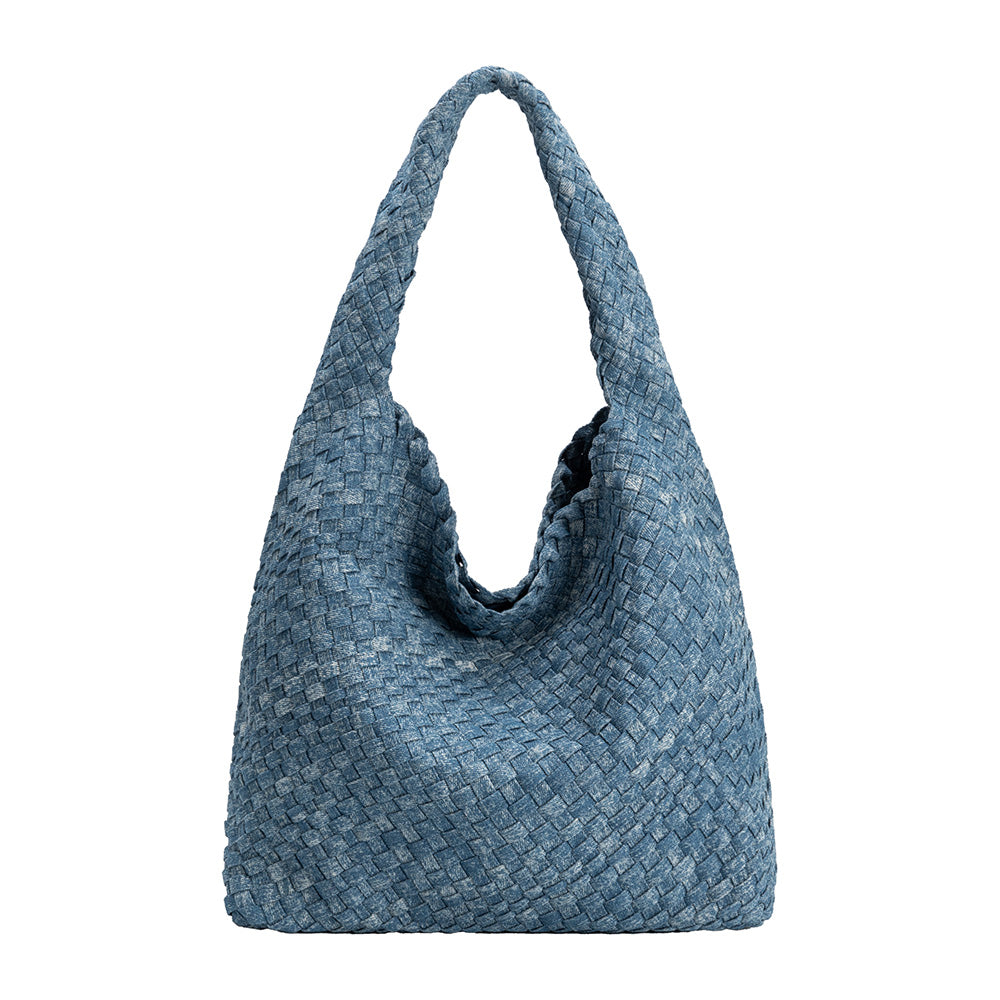 A large denim woven shoulder bag with a zip pouch inside