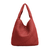 a large red woven vegan leather shoulder bag with a zip pouch inside