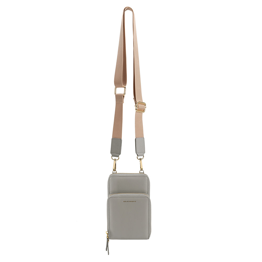A small dark gray vegan leather crossbody bag with a coin pouch.