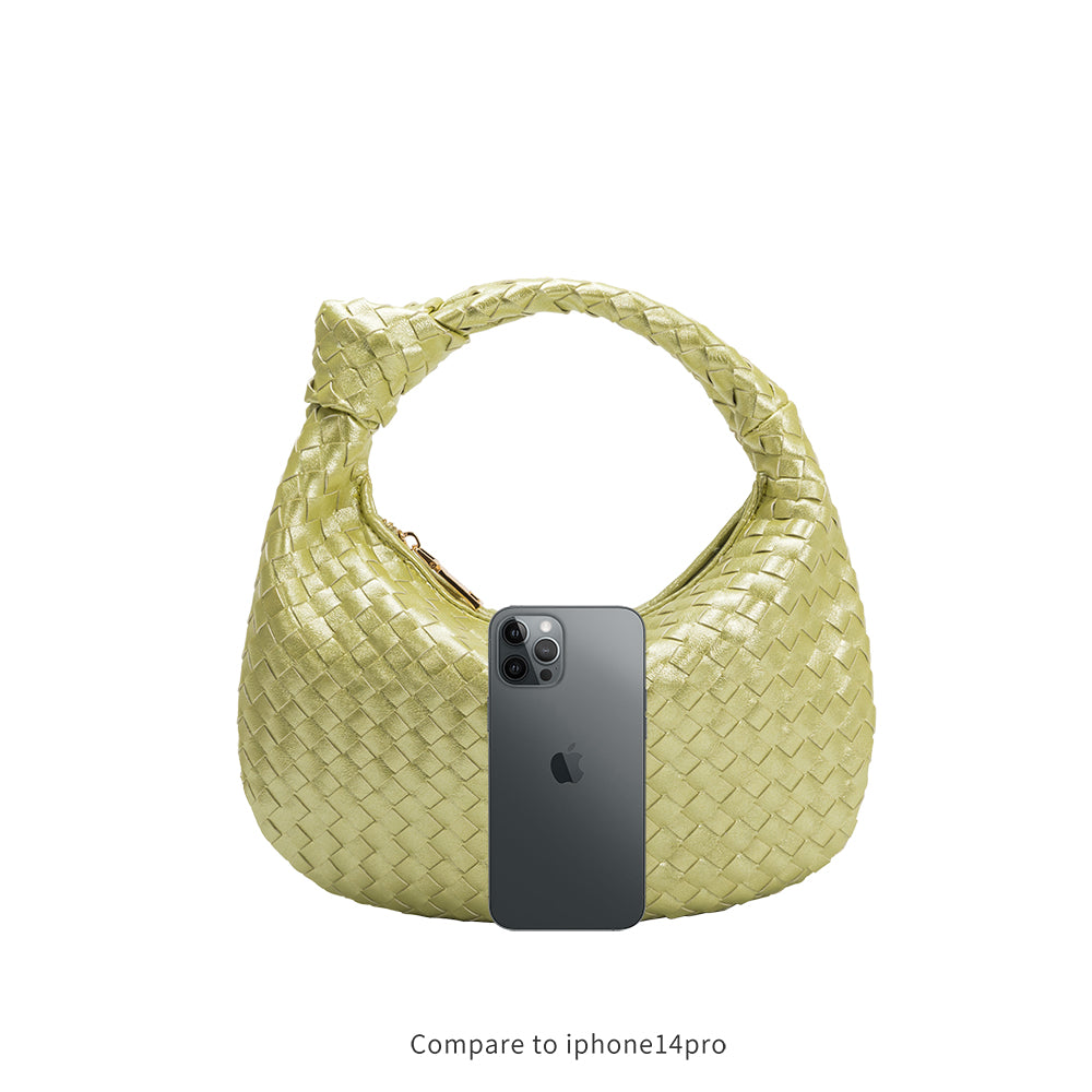an iphone 14 size comparison image for a small woven top handle bag with a knot handle