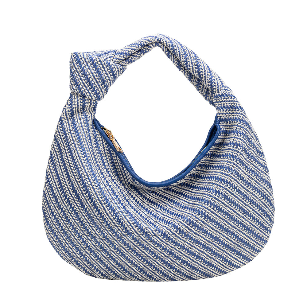 A large blue straw woven shoulder bag with a knot handle