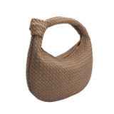 A cocoa recycled vegan leather shoulder bag with a knot.