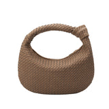 A cocoa recycled vegan leather shoulder bag with a knot.