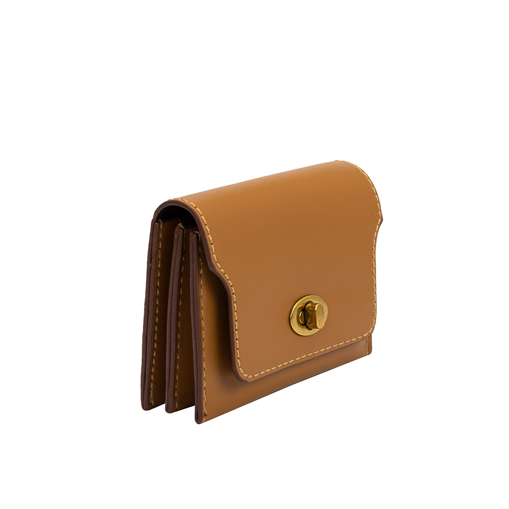 A small tan vegan leather card case wallet with a gold clasp. 