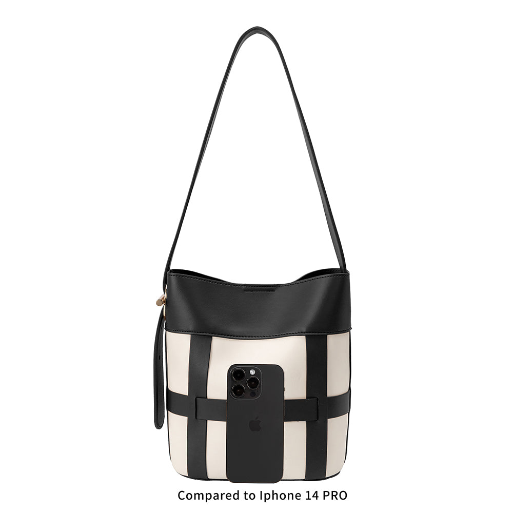 an iphone 14 size comparison image of a small vegan leather shoulder bag with a zip pouch inside.