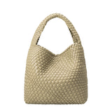 A large moss woven vegan leather shoulder bag.