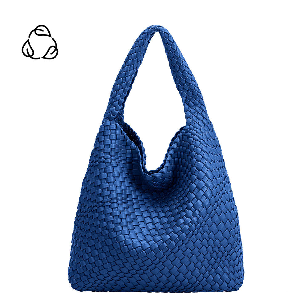 A large cobalt woven vegan leather shoulder bag with a zip pouch inside
