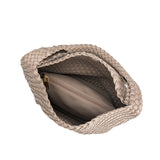 A large taupe woven vegan leather shoulder bag with a zip pouch inside. 