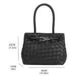 A measurement reference image for a hand woven vegan leather crossbody bag with a curved handle. 