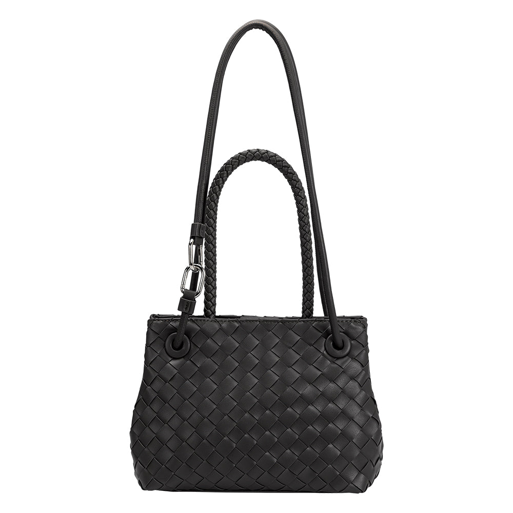 A black hand woven vegan leather crossbody bag with curved handle. 