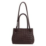 A espresso hand woven vegan leather crossbody bag with curved handle. 