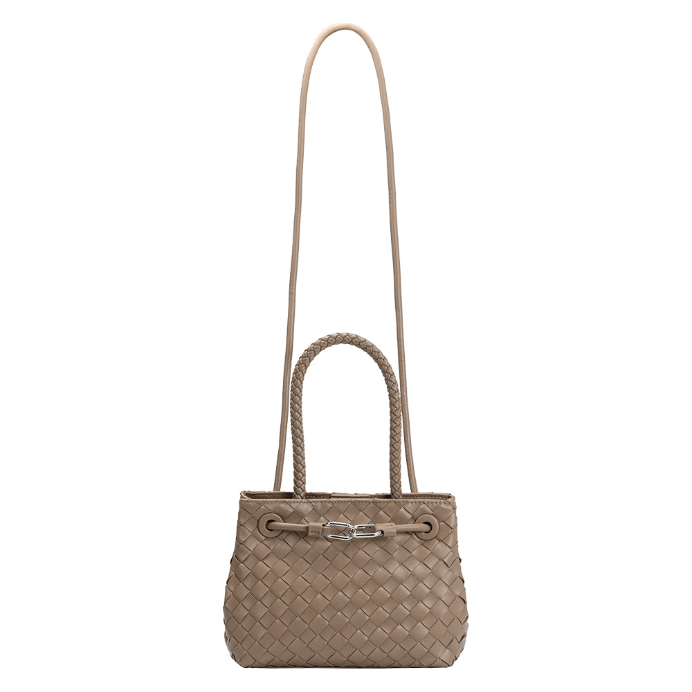A mushroom hand woven recycled vegan leather crossbody bag with a curved handle. 