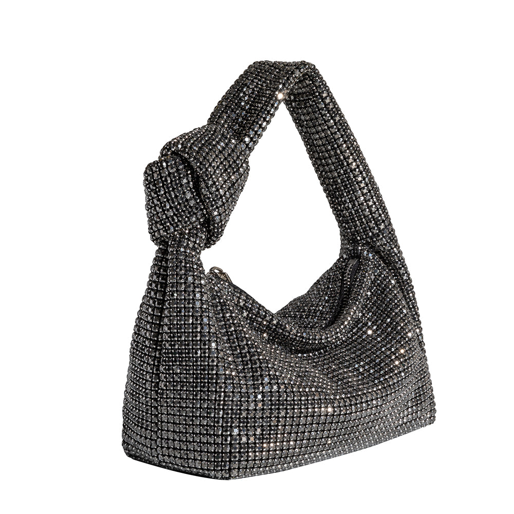 A small black crystal encrusted top handle bag with a knot. 