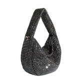 A small black crystal encrusted crossbody bag.