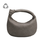 A strom suede recycled vegan leather shoulder bag with a knot. 