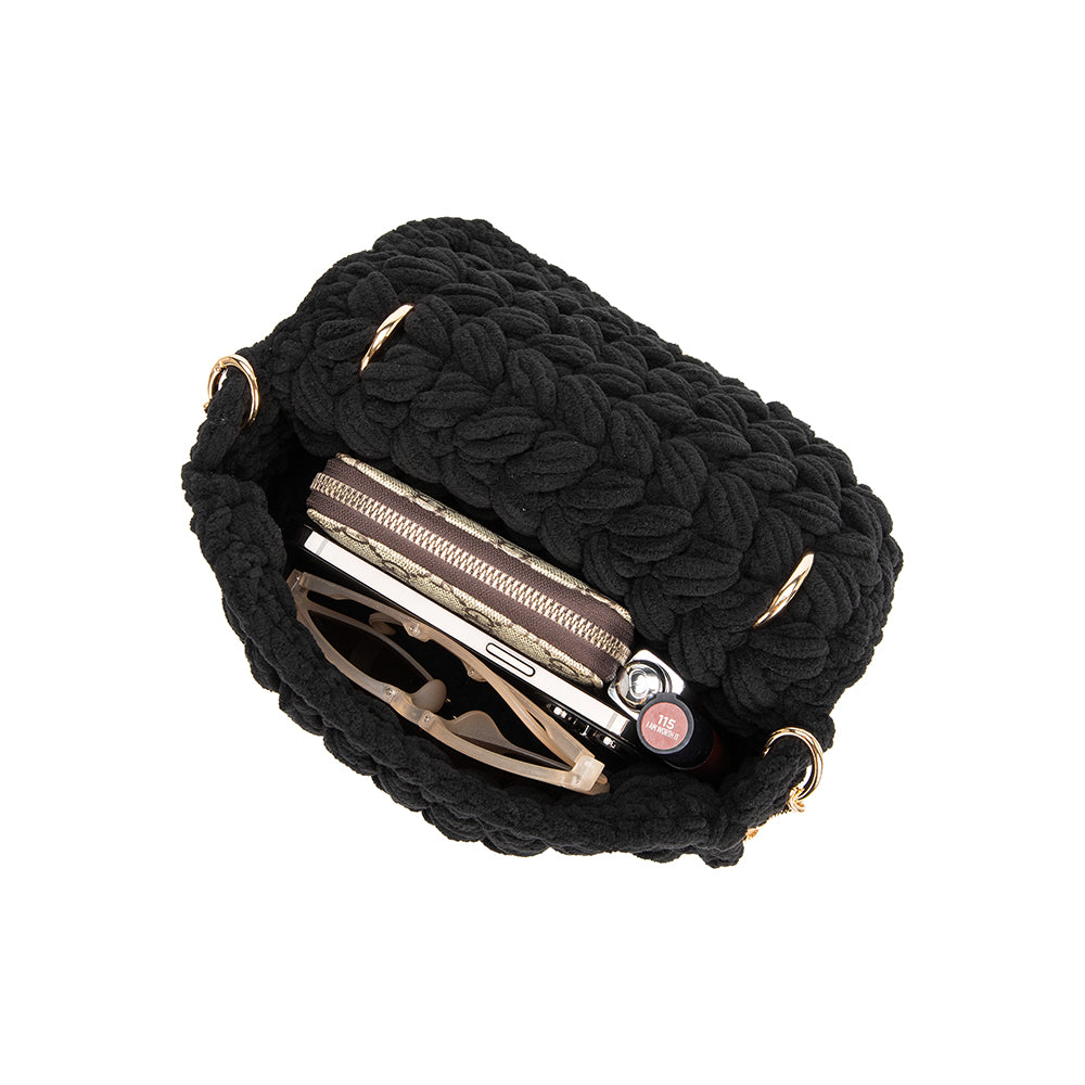 A BlackKnitted Crossbody handbag showing inside of handbag for measurement. Fitting a wallet, sunglasses, and lipgloss.