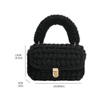 A black knitted handbag with gold clasp explaining measurements. 