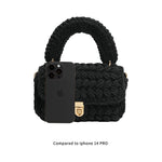 A black knitted handbag with gold clasp with an Iphone for space measurement. 
