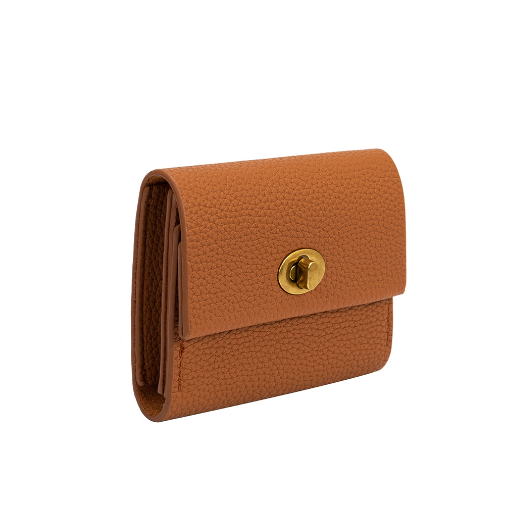 A small saddle pebble vegan leather card case wallet with a gold clasp. 