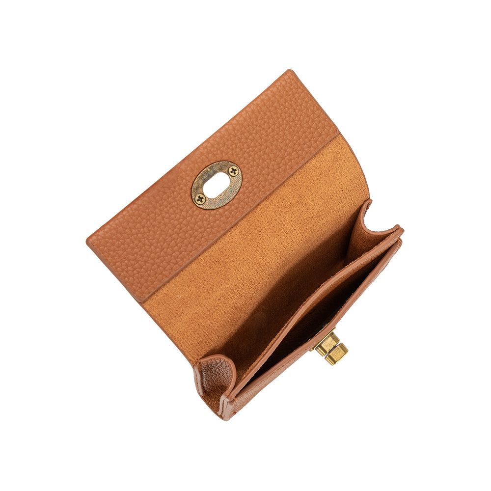 A small saddle pebble vegan leather card case wallet with a gold clasp. 