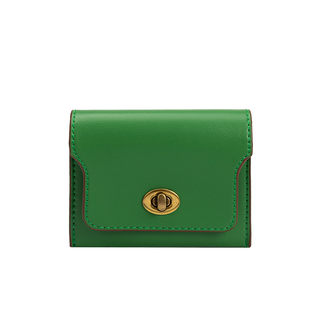 A small green vegan leather card case wallet with a gold clasp. 