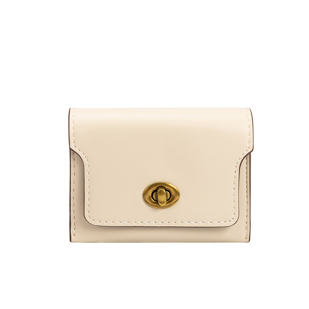 A small ivory vegan leather card case wallet with a gold clasp. 