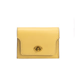 A small yellow vegan leather card case wallet with a gold clasp. 