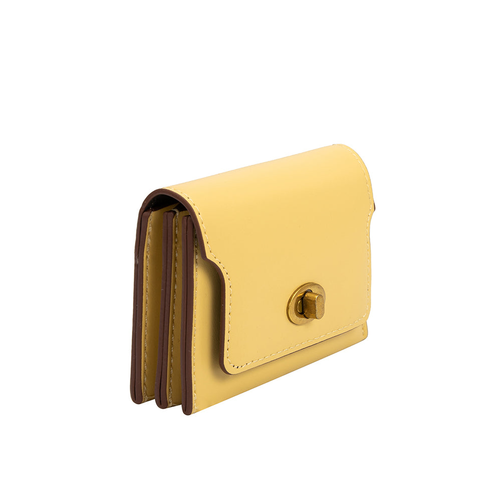 A small yellow vegan leather card case wallet with a gold clasp. 