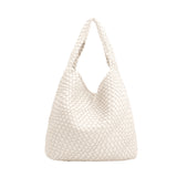 A large off white woven vegan leather shoulder bag with a zip pouch inside