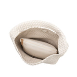 A large off white woven vegan leather shoulder bag with a zip pouch inside