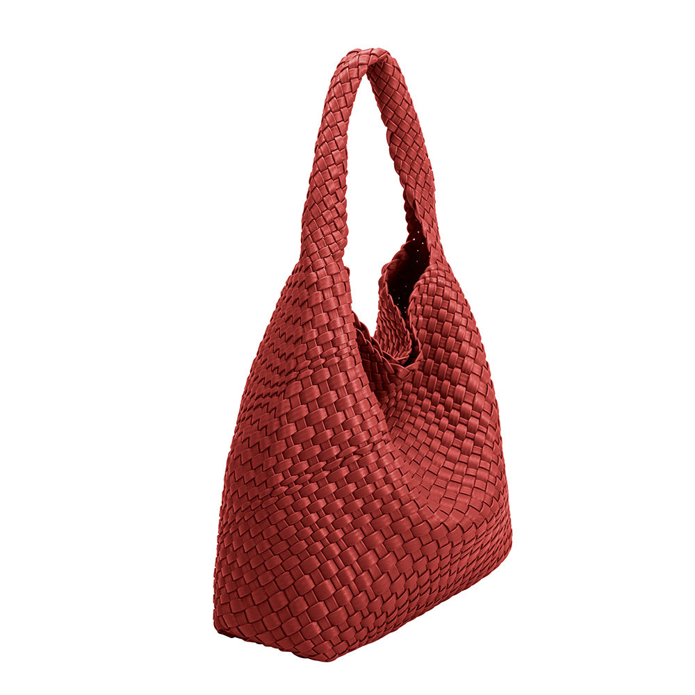 a large red woven vegan leather shoulder bag with a zip pouch inside