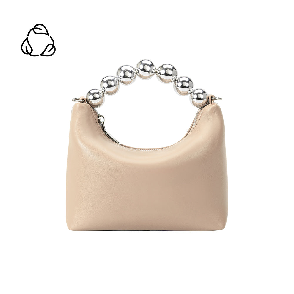 A small bone recycled vegan leather top handle bag with silver beaded handle. 