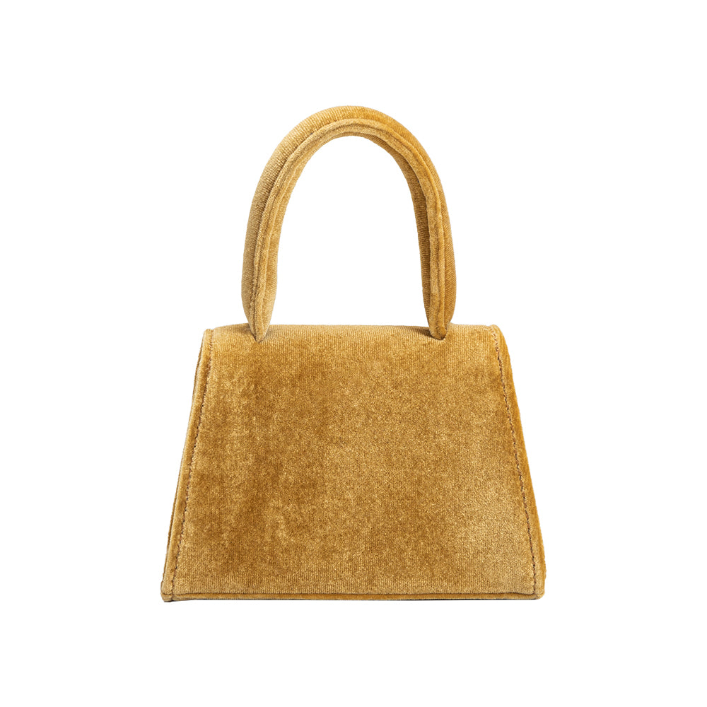 A mini gold velvet top handle bag with a silver encrusted bow.