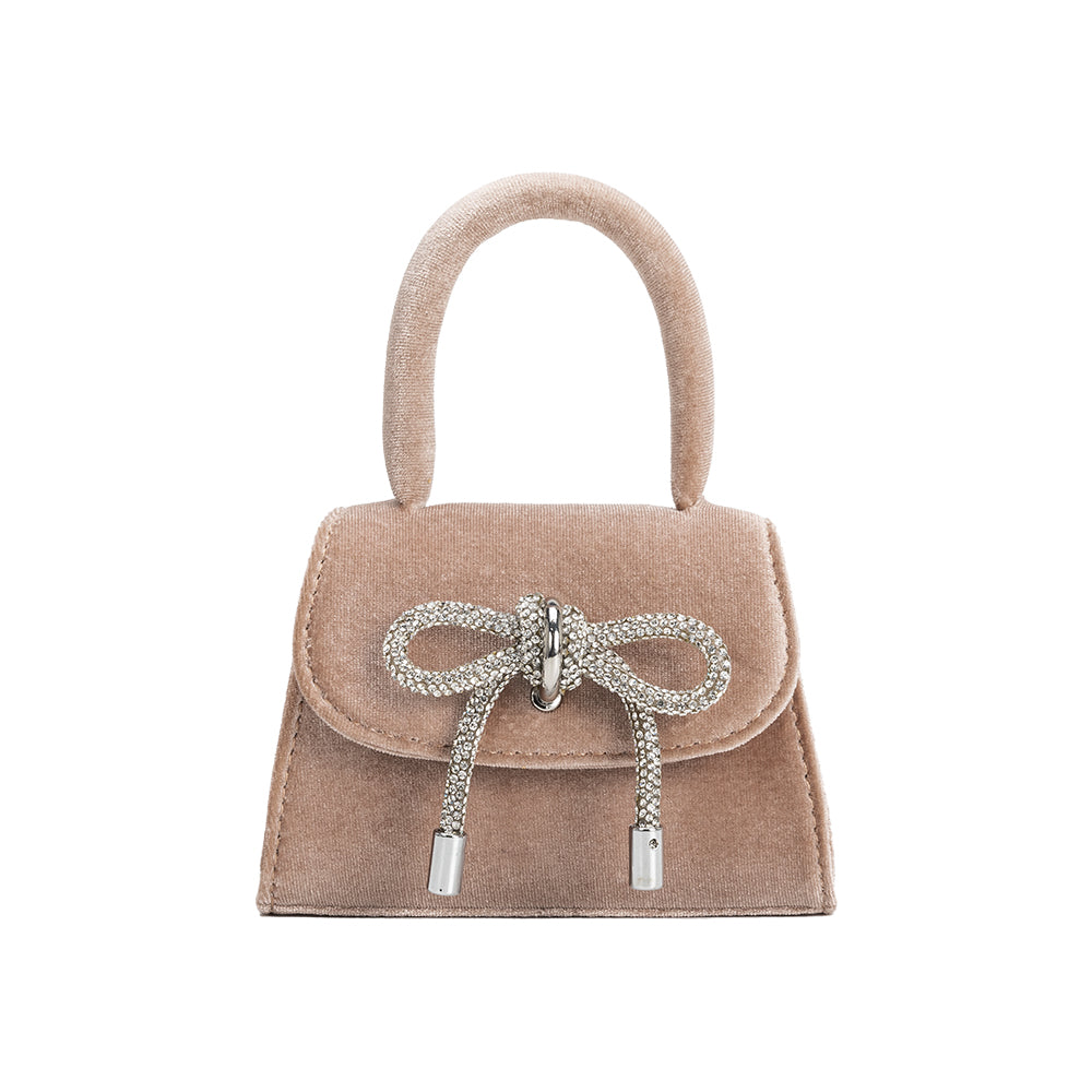 A mini taupe velvet top handle bag with a silver encrusted bow.