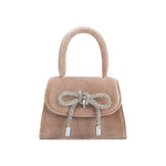 A mini taupe velvet top handle bag with a silver encrusted bow.