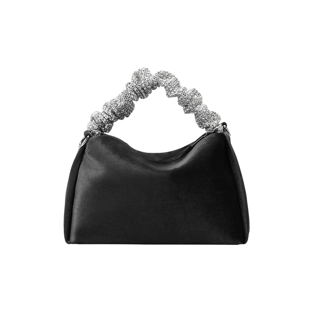 A medium velvet black top handle bag with a silver encrusted handle. 