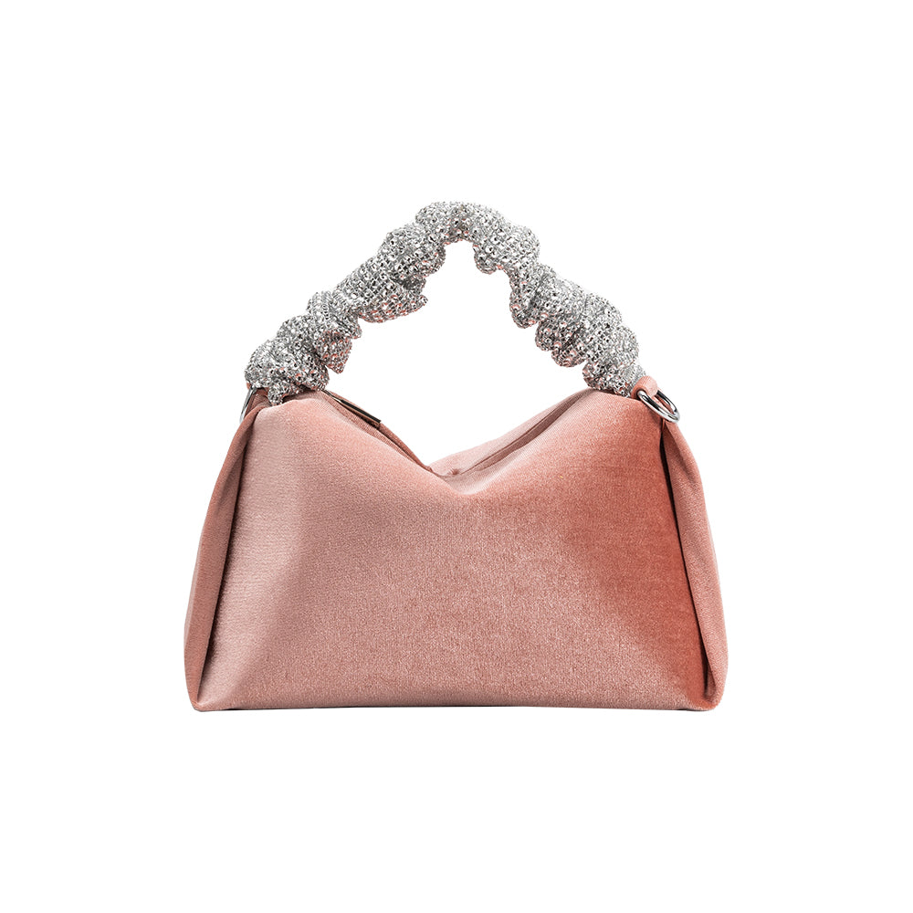 A medium velvet blush top handle bag with a silver encrusted handle. 