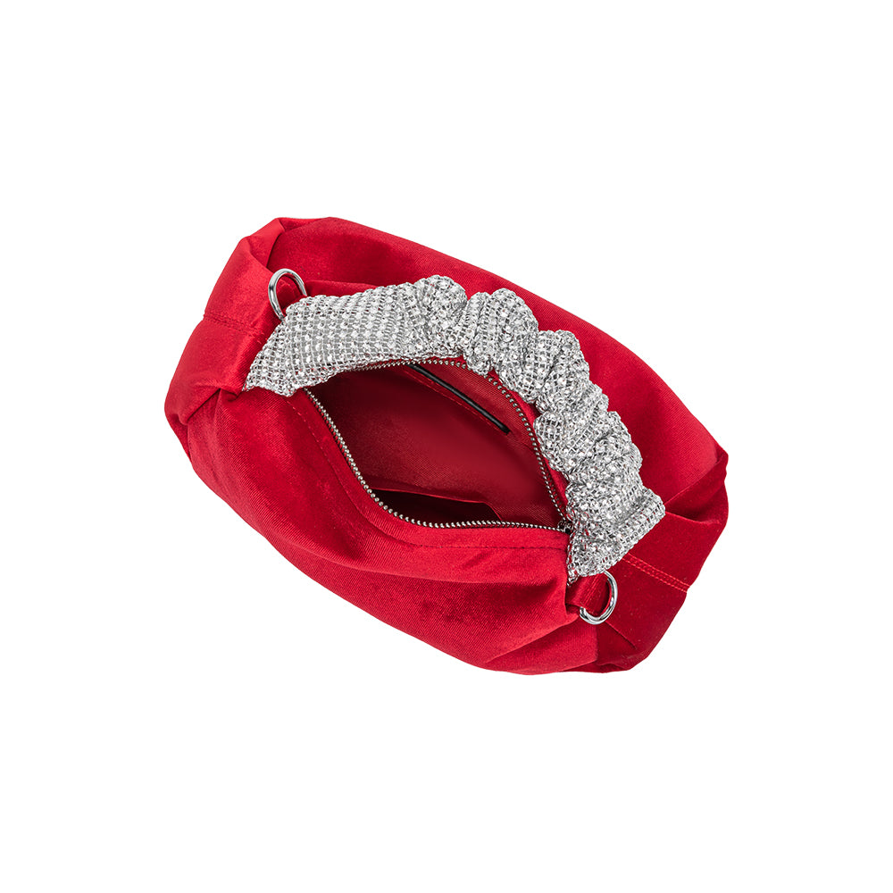 A medium red velvet top handle bag with silver encrusted handle. 