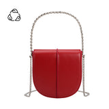 A red vegan leather crossbody bag with silver handle. 