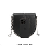 A black vegan leather crossbody handbag with silver handle. 