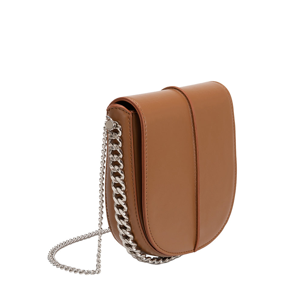 A tan vegan leather crossbody handbag with silver handle. 