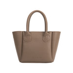 A taupe recycled vegan leather top handle bag with silver bubble hardware.
