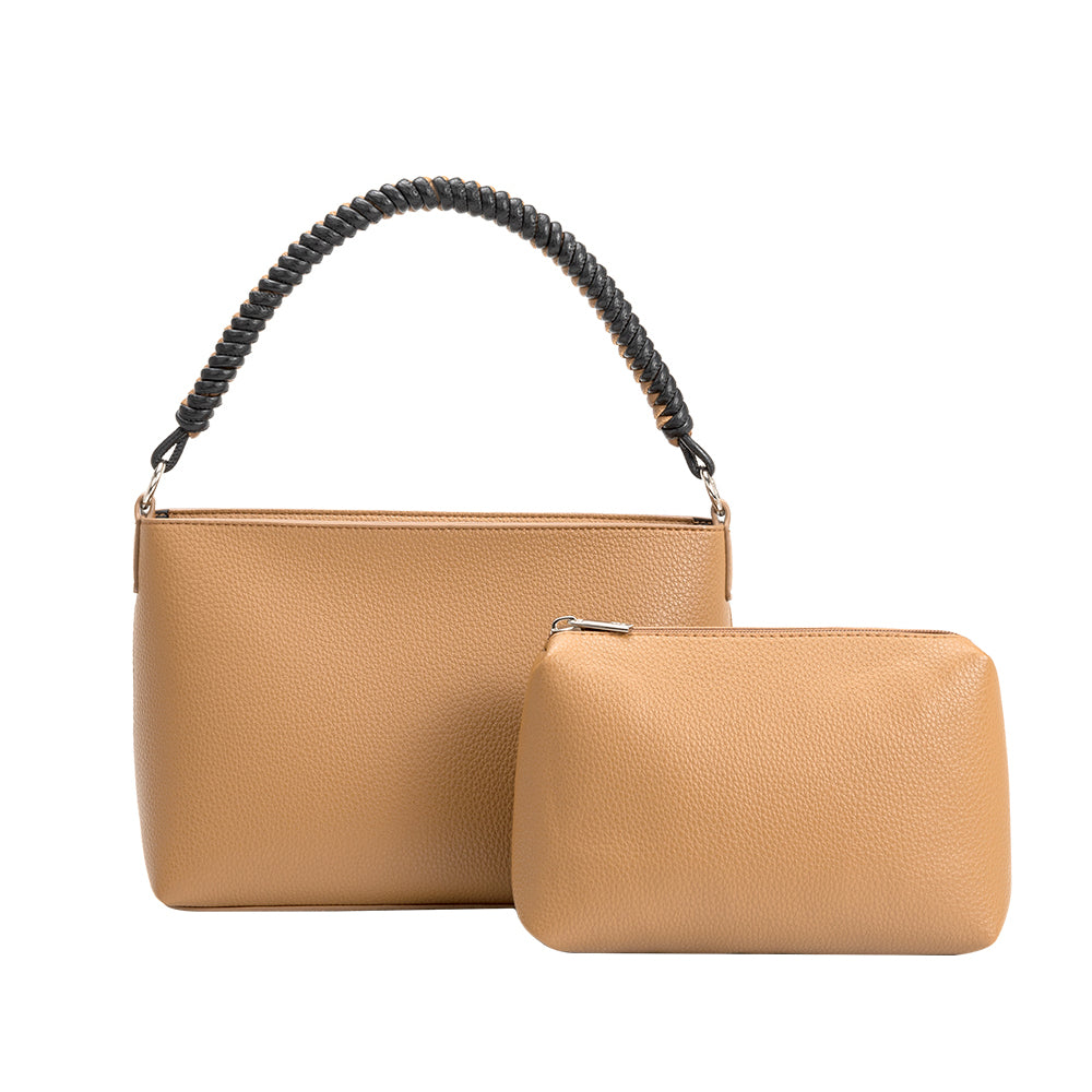 A nude small vegan leather crossbody handbag with a nude zip pouch. 