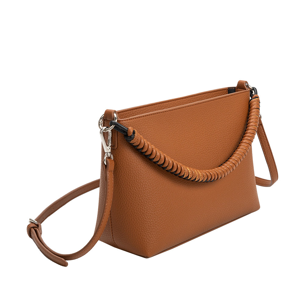 A saddle small recycled vegan leather crossbody handbag with a woven handle. 