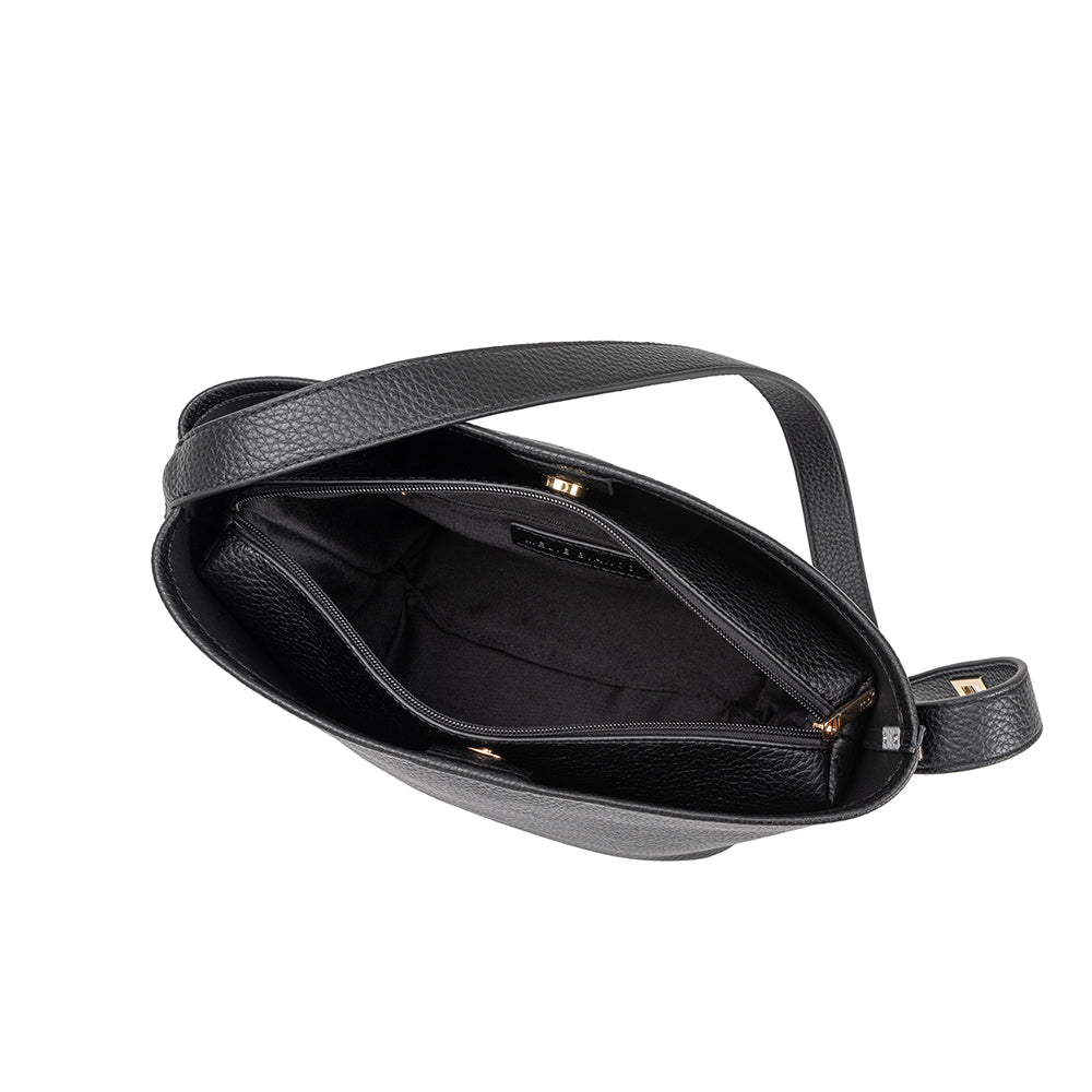 A black recycled vegan leather shoulder bag with zip pouch inside. 